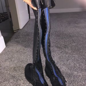 Black studded boots with blue zipper on back